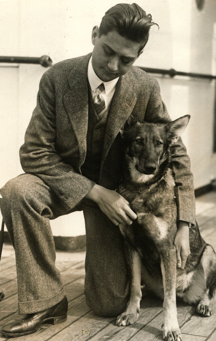 Morris Frank kneeling with buddy