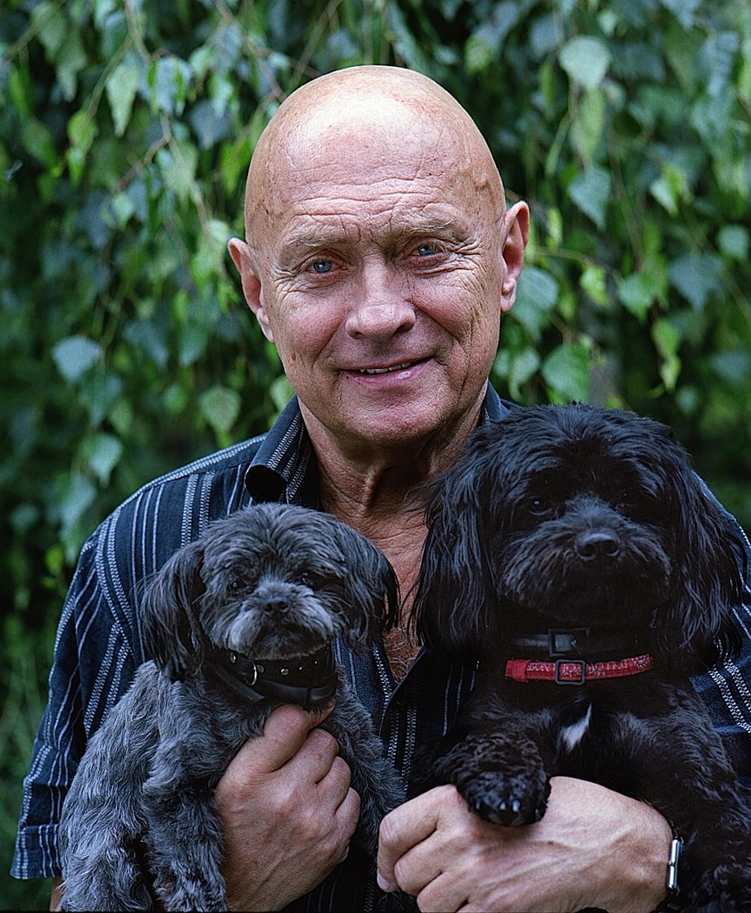 An senior man with two dogs