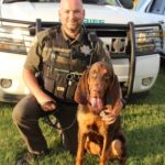 Police officer with Fred the bloodhound