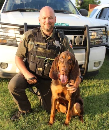 Police officer with Fred the bloodhound